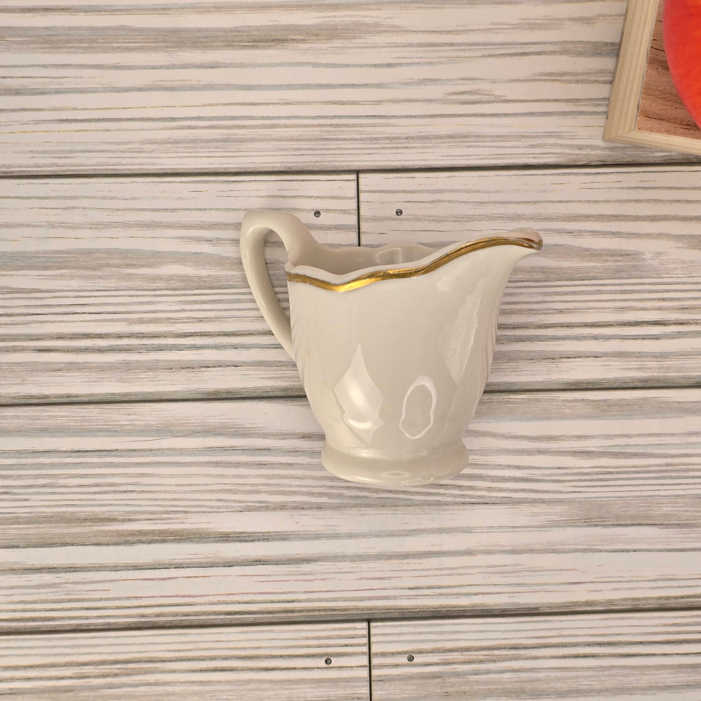 Syracuse China Ivory Creamer with Gold Trim